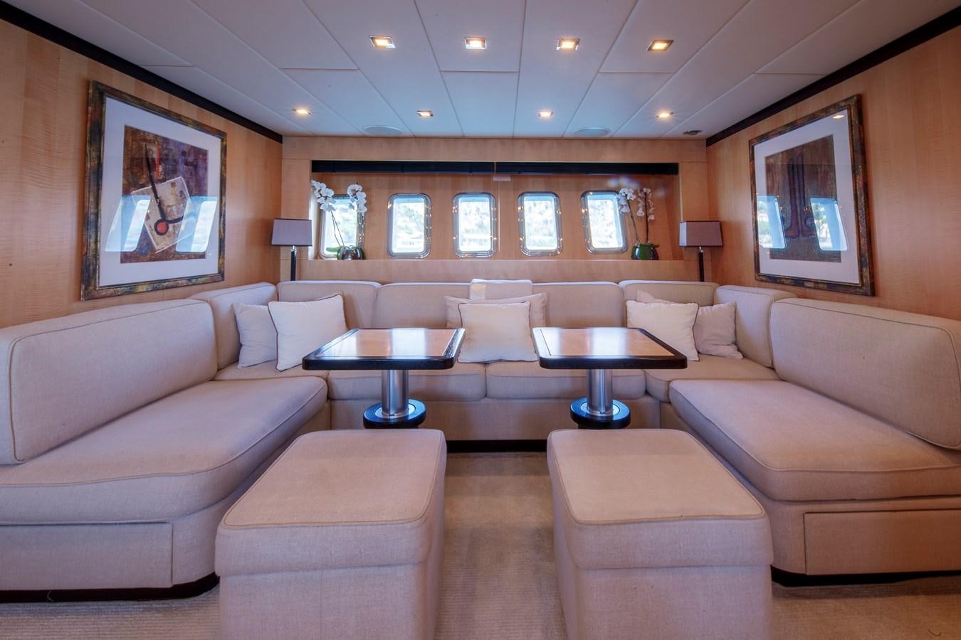 a living room with a couch and a coffee table aboard ULTIMA BEACH Yacht for Sale