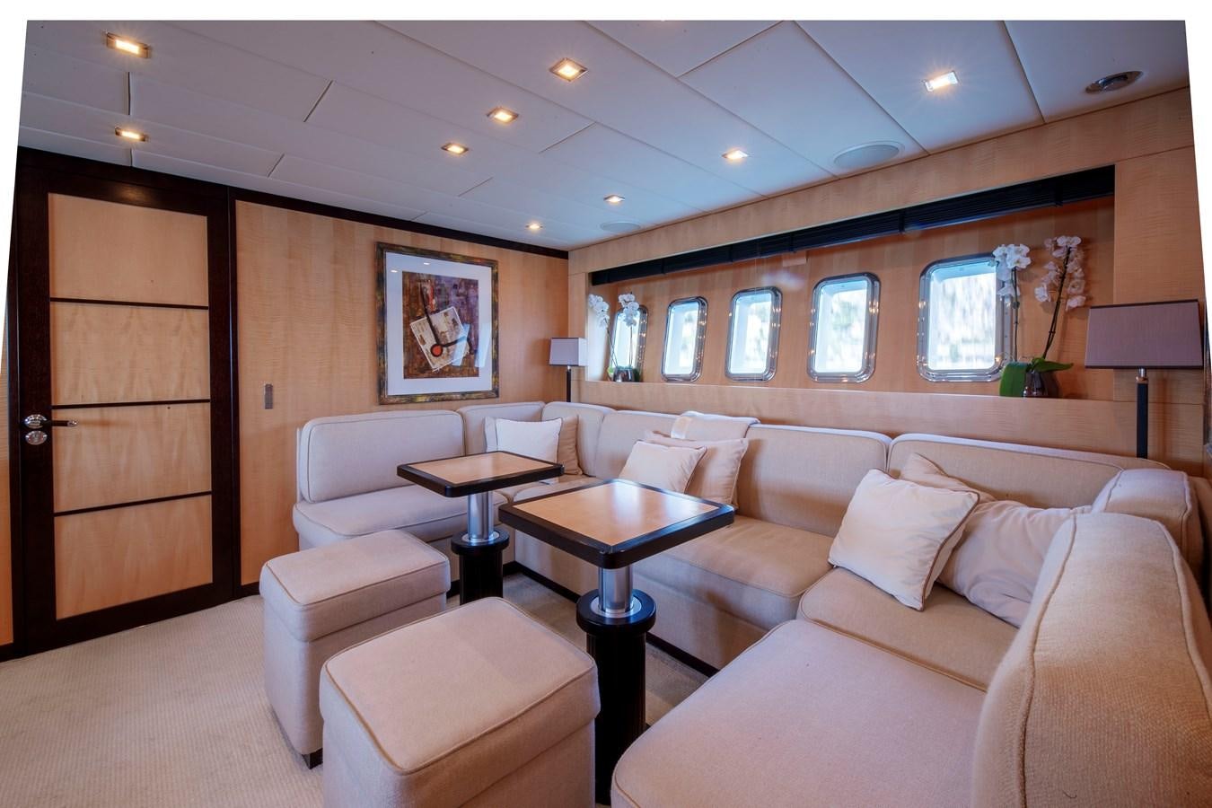 a living room with a couch and a coffee table aboard ULTIMA BEACH Yacht for Sale