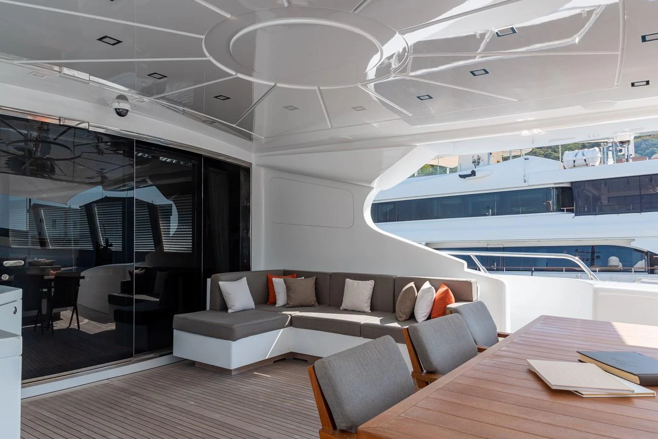 a room with a couch and a table and a large window aboard ASYA Yacht for Sale