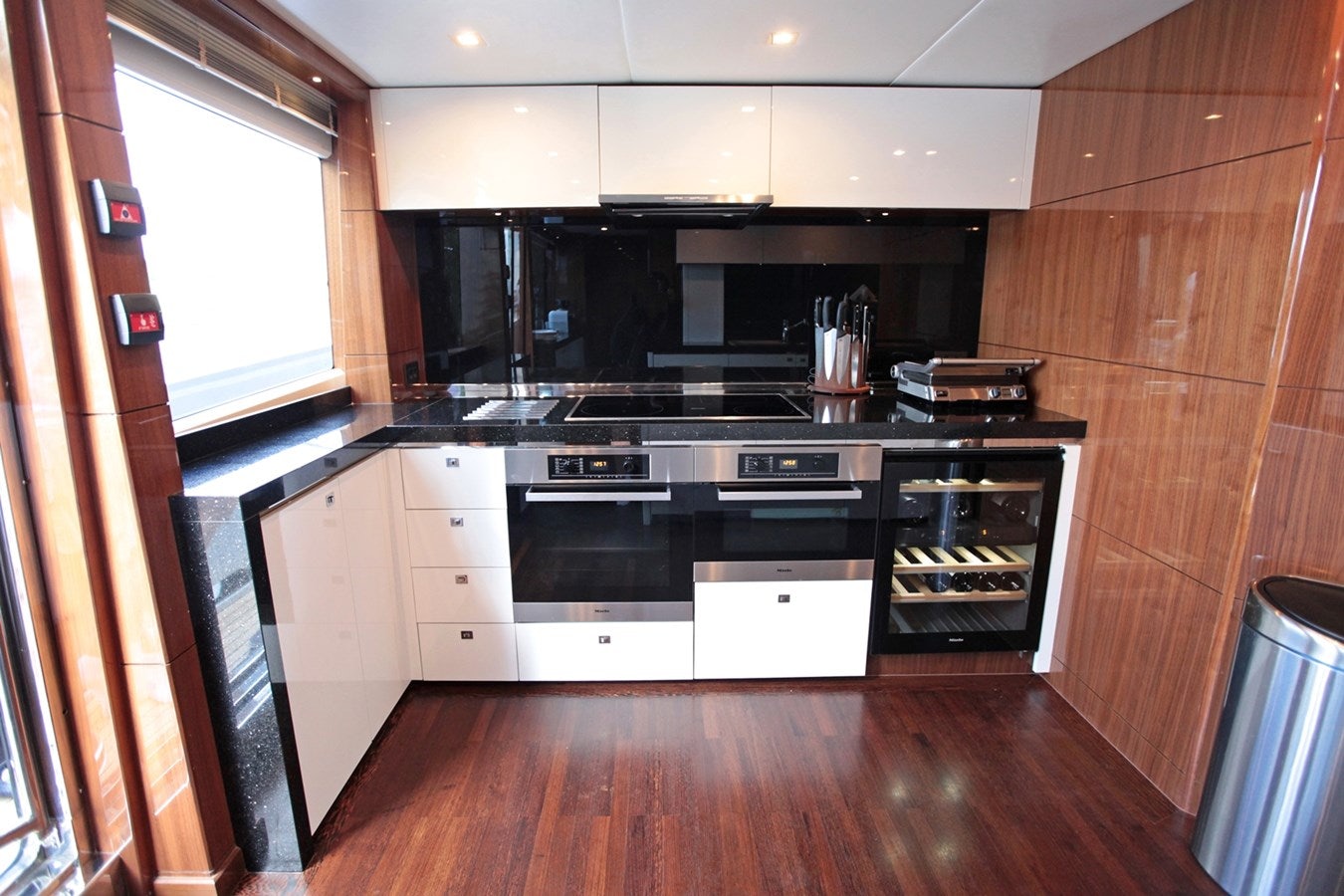 a kitchen with a wood floor aboard SEABEACH Yacht for Sale