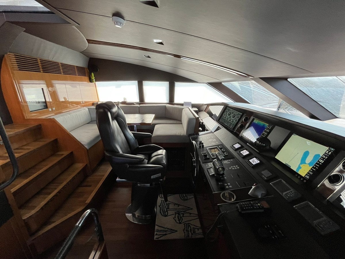 a room with a desk and chairs aboard SEABEACH Yacht for Sale