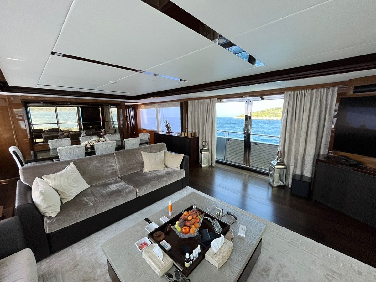a living room with a couch and a coffee table aboard SEABEACH Yacht for Sale