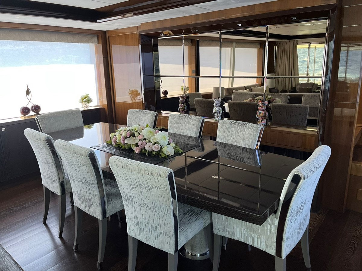 a dining room with a table and chairs aboard SEABEACH Yacht for Sale