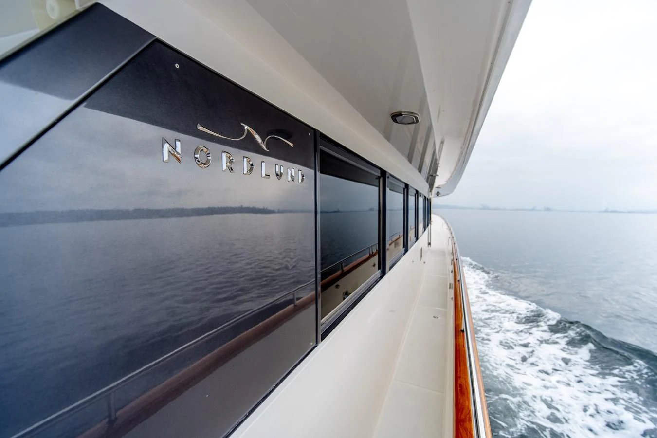 a boat with a sign on the side aboard SHADOWFAX Yacht for Sale