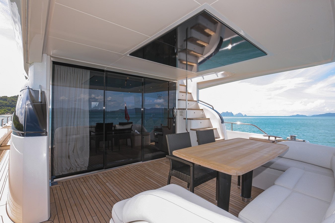 a room with a table and chairs aboard SE1 Yacht for Sale