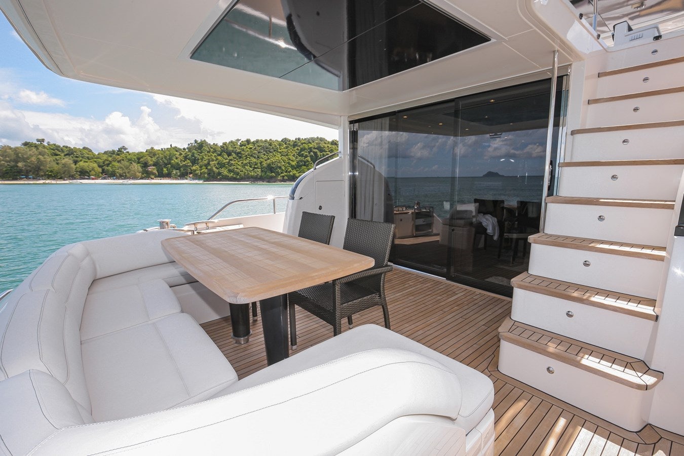 a room with a table and chairs aboard SE1 Yacht for Sale
