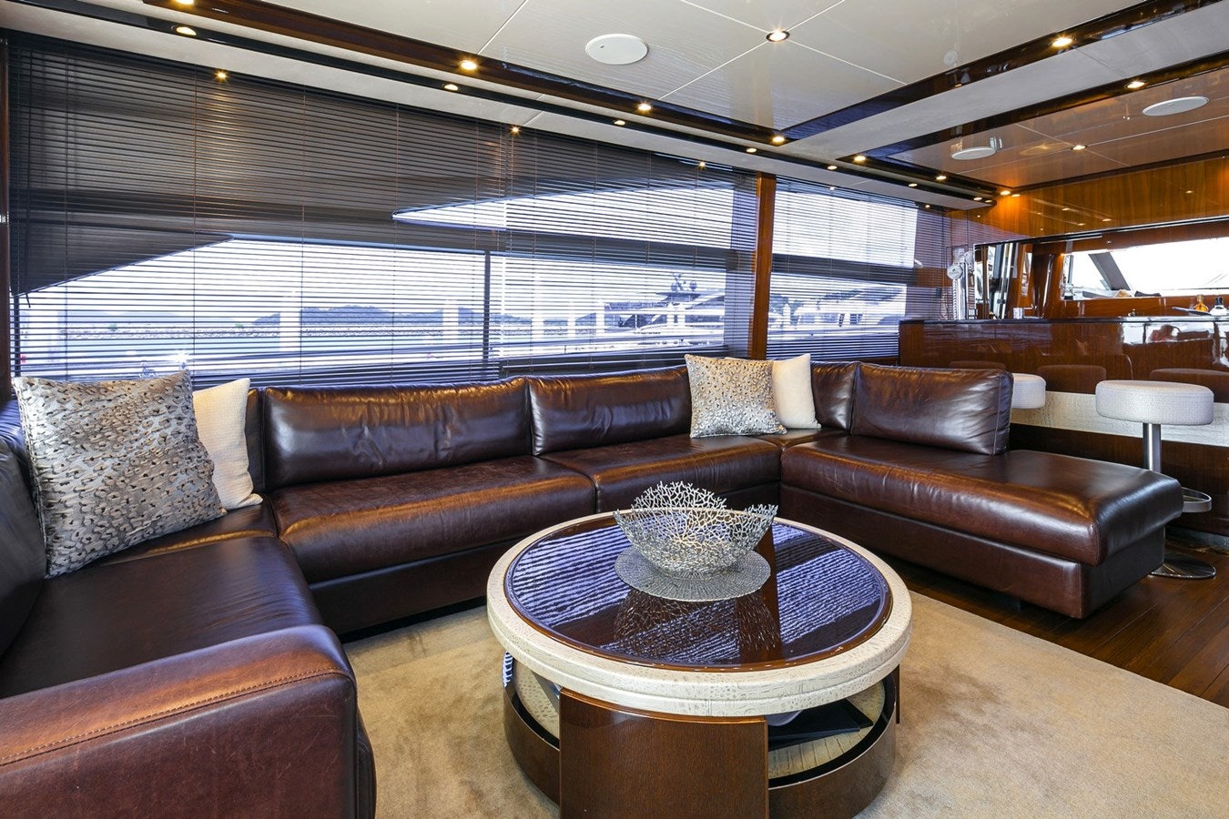 a room with leather couches and a table aboard SE1 Yacht for Sale