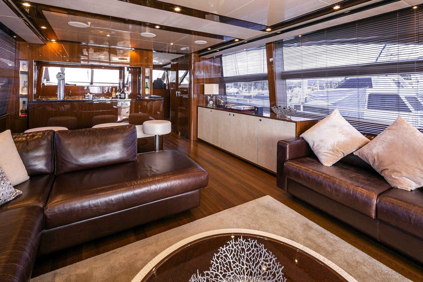 a living room with leather couches aboard SE1 Yacht for Sale