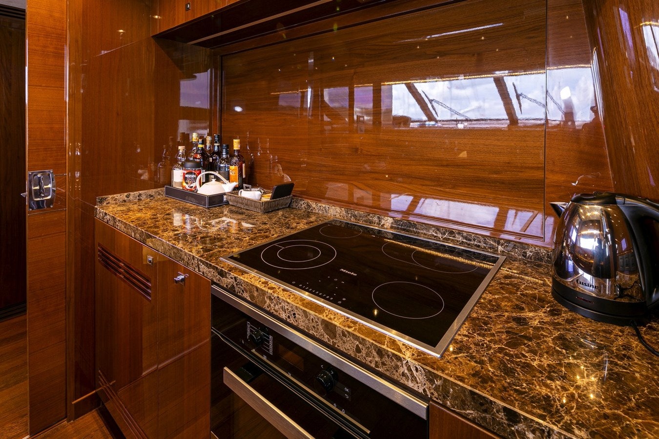 a kitchen with a stove and a kettle on the stove aboard SE1 Yacht for Sale