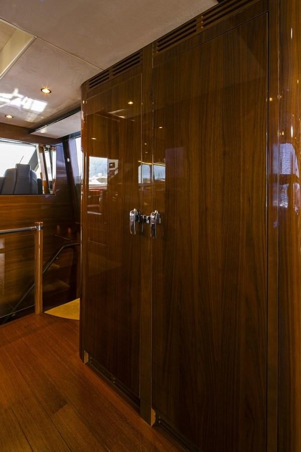 a large wooden closet aboard SE1 Yacht for Sale