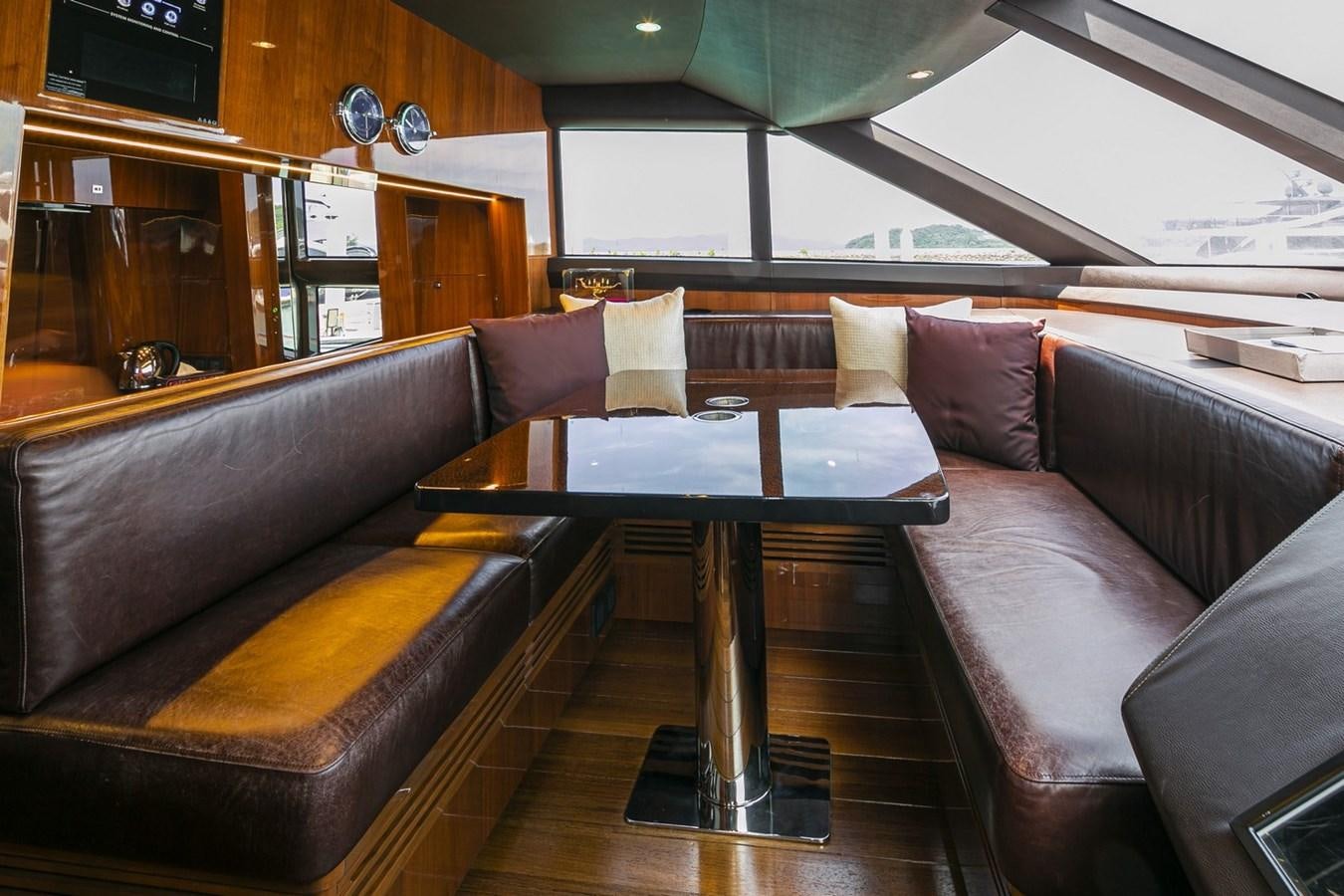 a couch and a table in a room aboard SE1 Yacht for Sale
