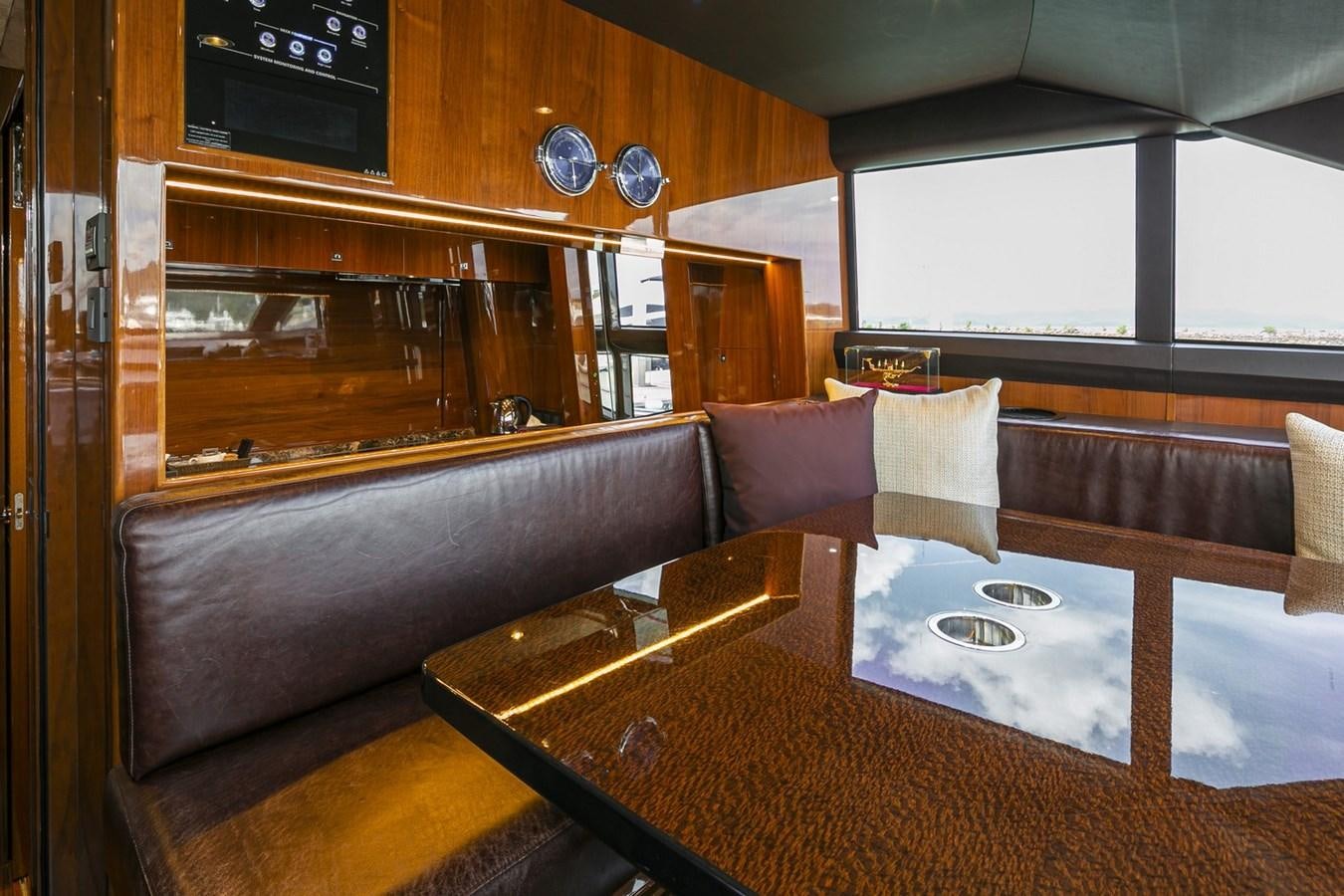 a bar with a table and chairs aboard SE1 Yacht for Sale