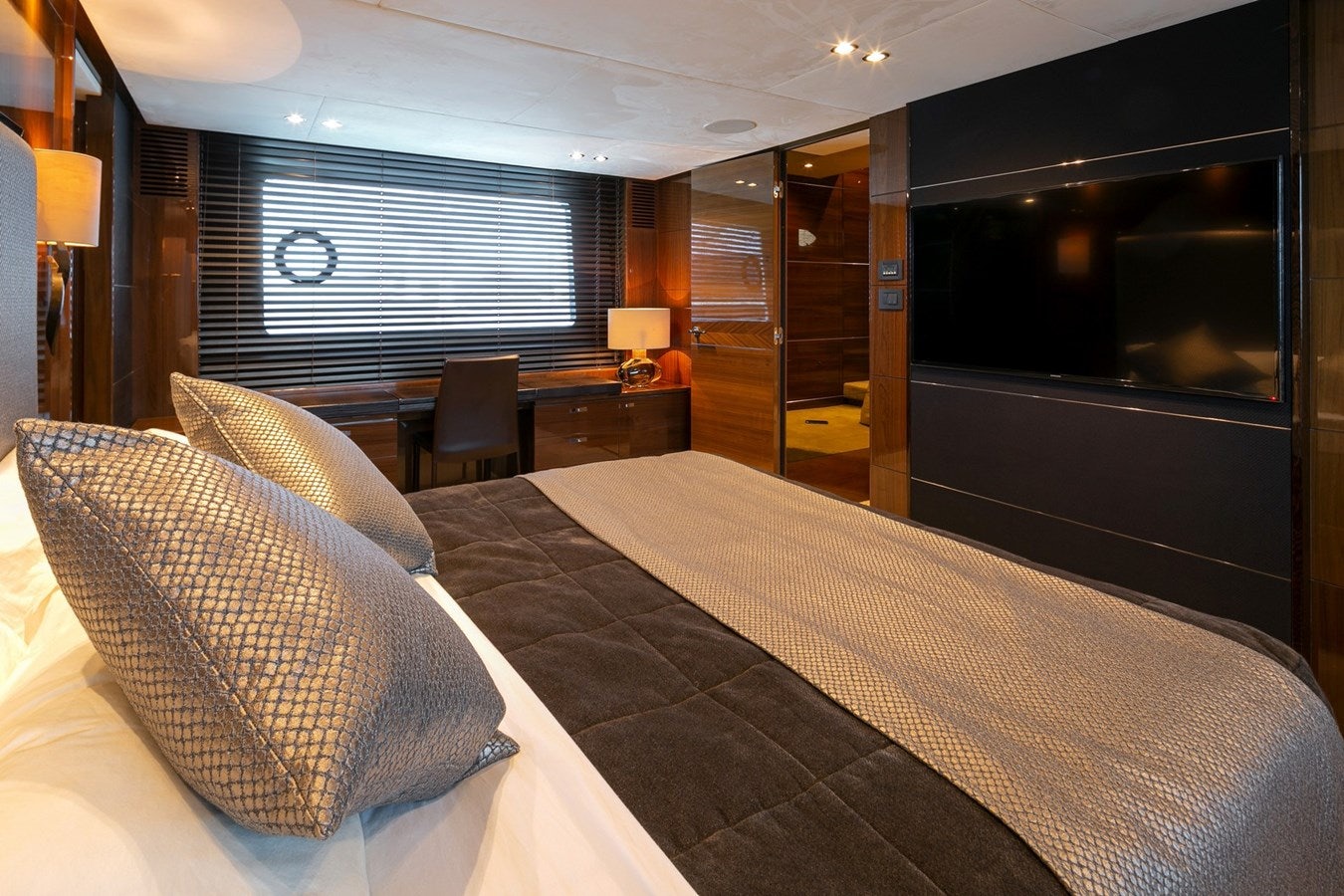 a hotel room with a bed and a desk aboard SE1 Yacht for Sale
