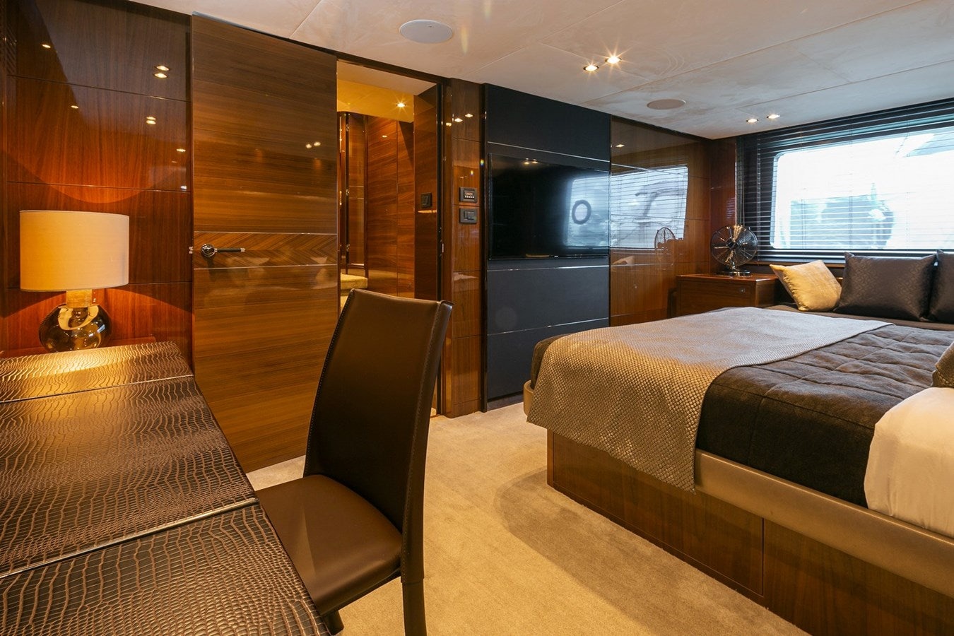a hotel room with a bed and a desk aboard SE1 Yacht for Sale