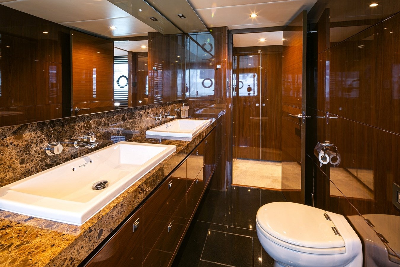 a bathroom with a large mirror aboard SE1 Yacht for Sale