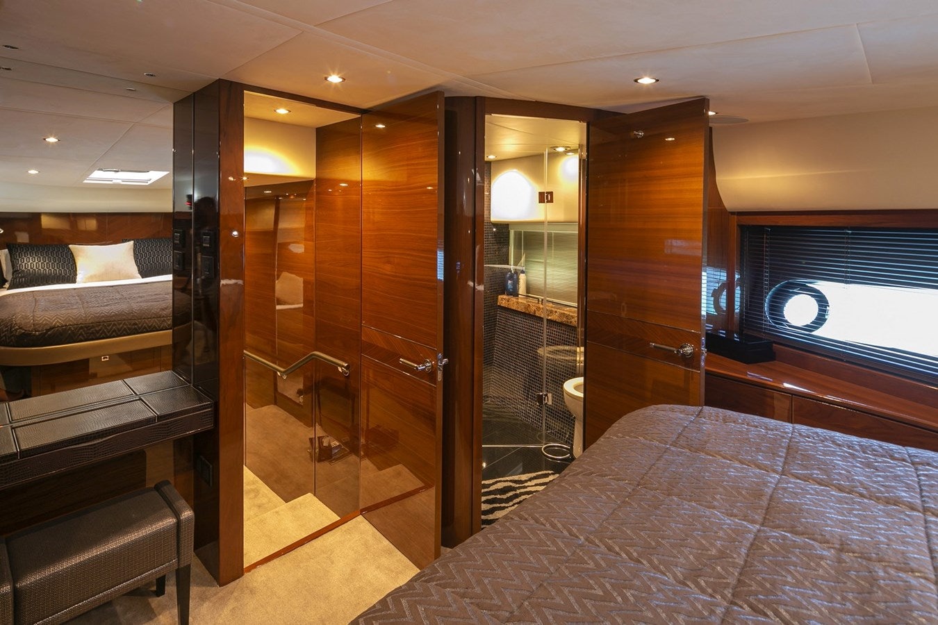a room with a bed and a glass door aboard SE1 Yacht for Sale