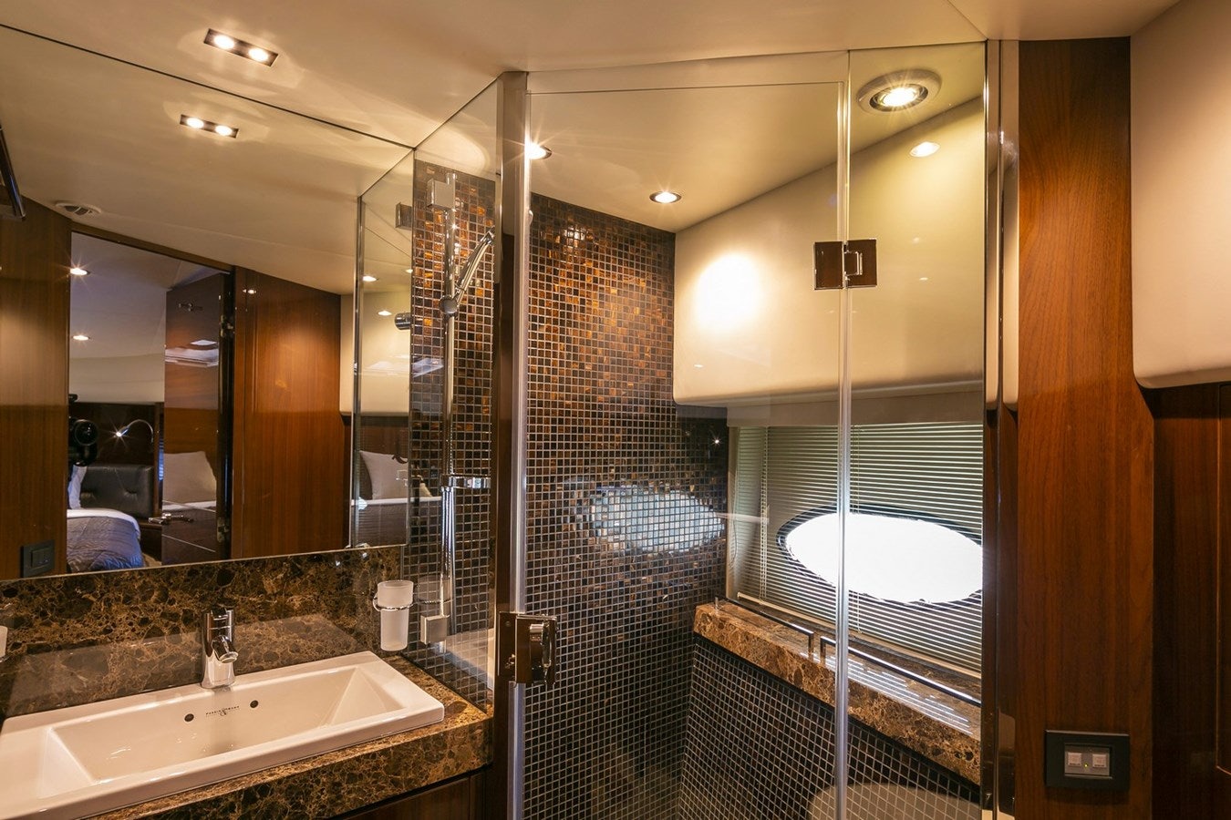 a bathroom with a large mirror aboard SE1 Yacht for Sale