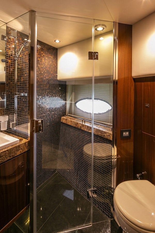 a bathroom with a glass shower aboard SE1 Yacht for Sale