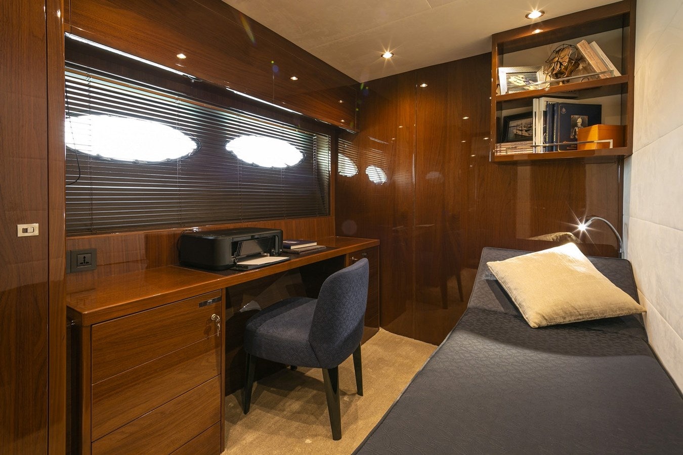 a bedroom with a bed and desk aboard SE1 Yacht for Sale