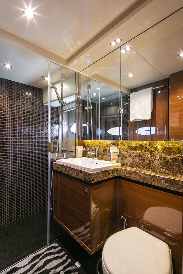 a bathroom with a large mirror aboard SE1 Yacht for Sale