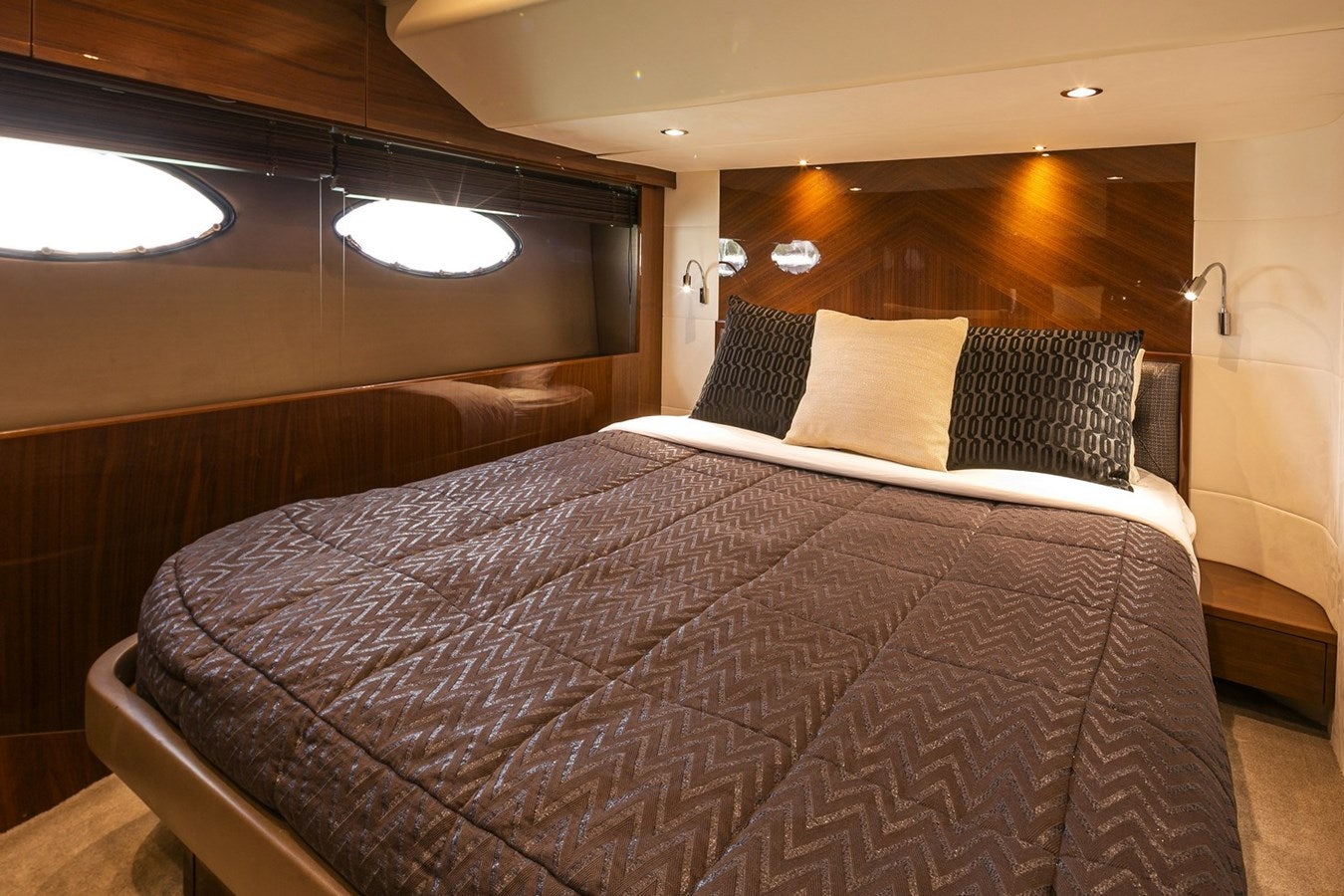 a bed with pillows aboard SE1 Yacht for Sale