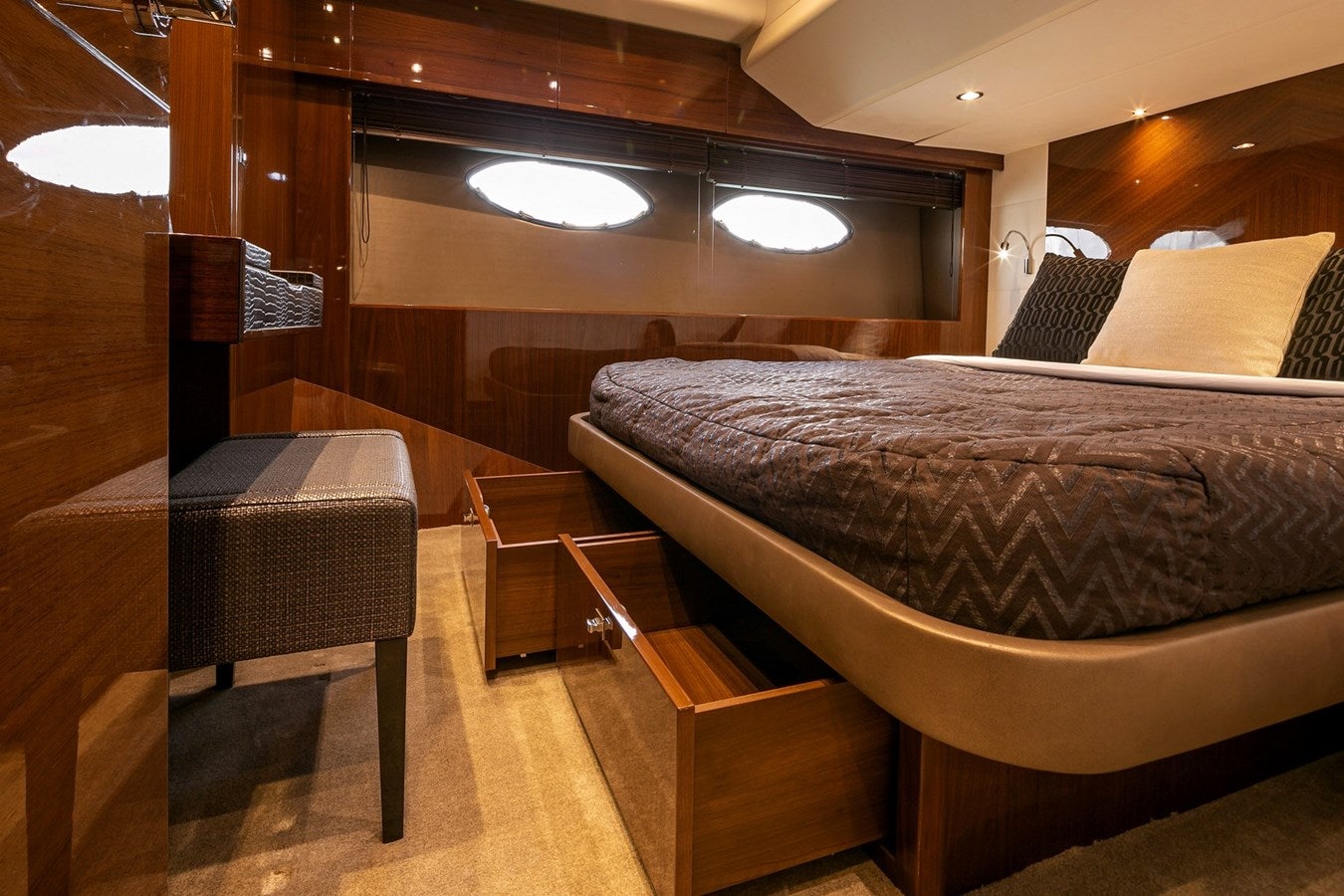 a bed with a black comforter aboard SE1 Yacht for Sale