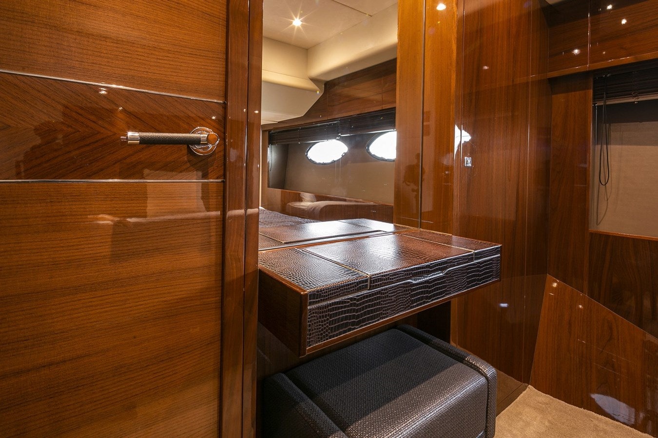 a wood cabinet with a bench aboard SE1 Yacht for Sale