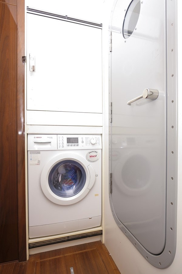 a washer and dryer in a room aboard SE1 Yacht for Sale