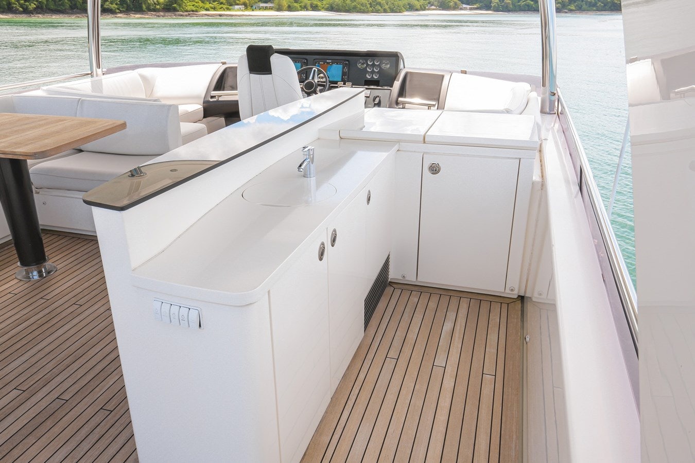 a white boat on a dock aboard SE1 Yacht for Sale