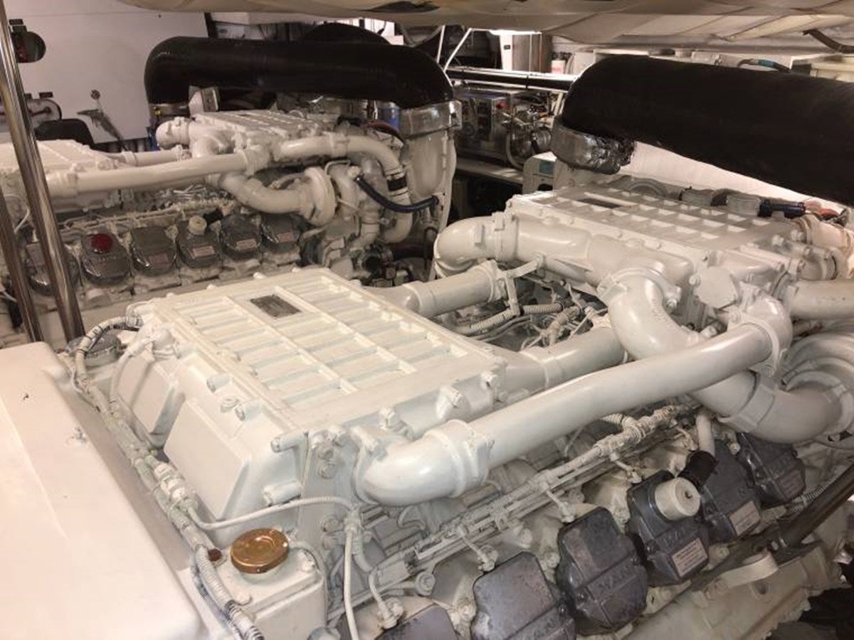 a car engine with a large amount of batteries in it aboard HOLY SHIT Yacht for Sale