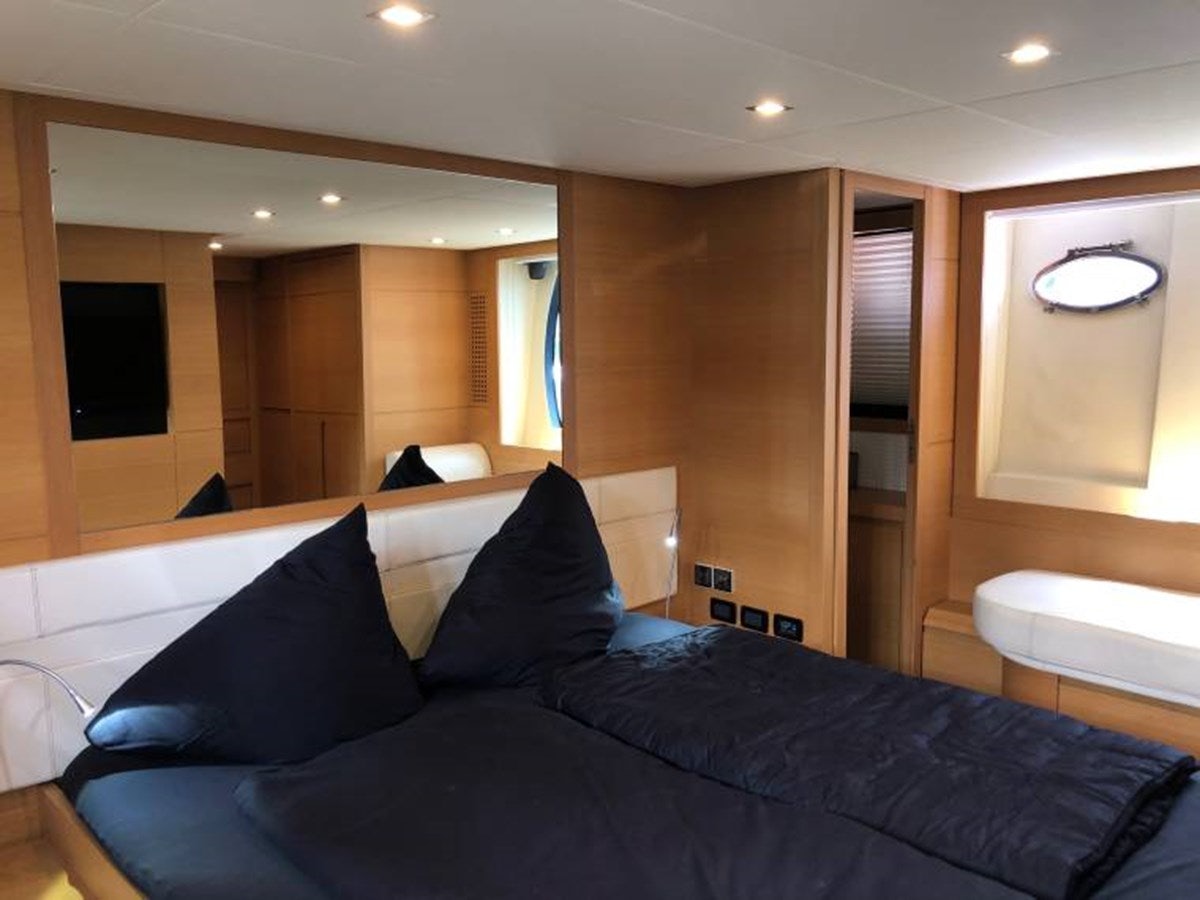 a bed in a room aboard HOLY SHIT Yacht for Sale