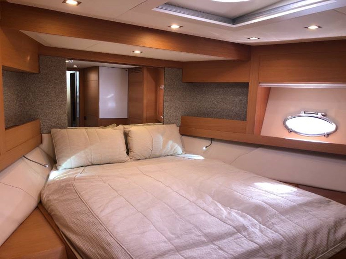 a bed in a room aboard HOLY SHIT Yacht for Sale