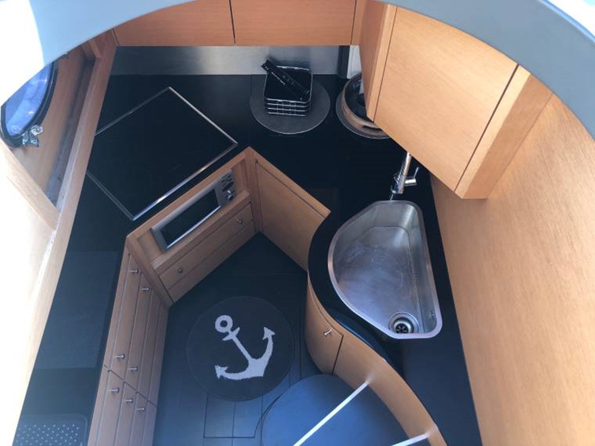 a black and white laundry basket aboard HOLY SHIT Yacht for Sale