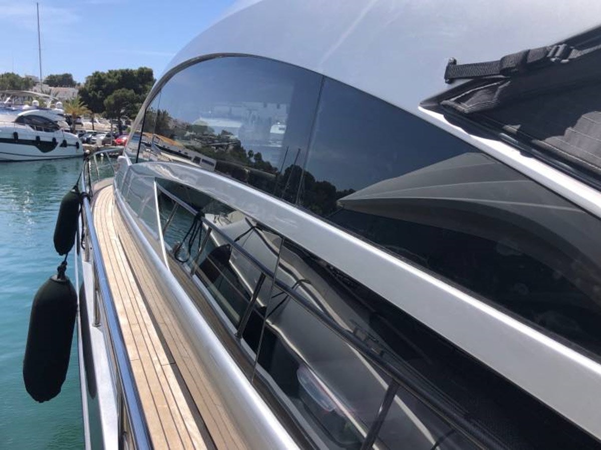 a car with its door open aboard HOLY SHIT Yacht for Sale