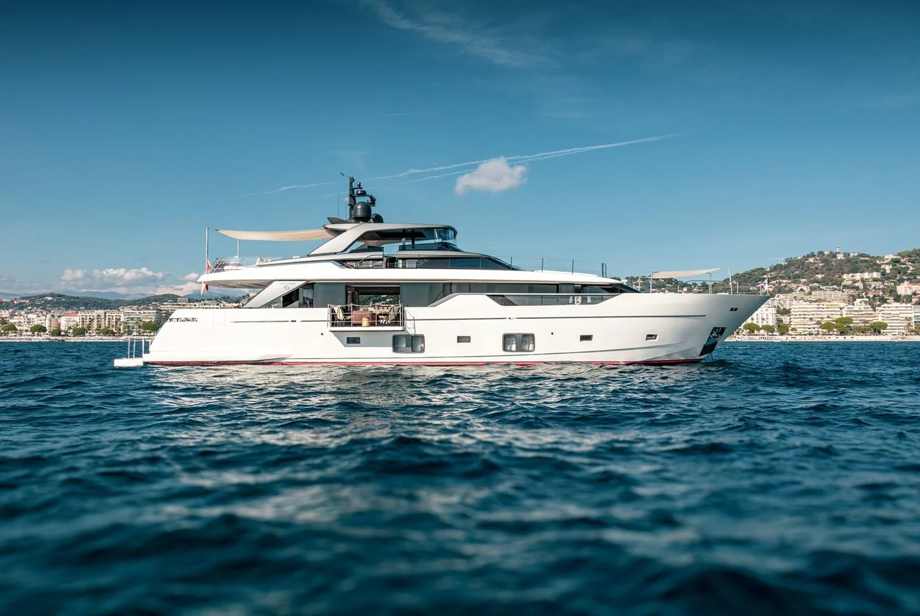 a white yacht in the water aboard THE GREAT ESCAPE Yacht for Sale