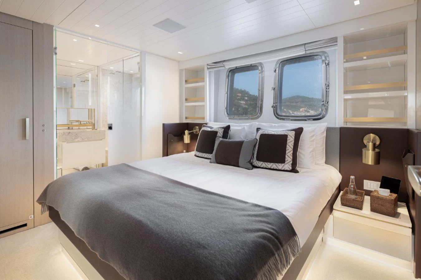 a bedroom with a large bed aboard THE GREAT ESCAPE Yacht for Sale