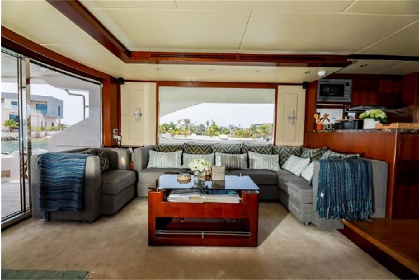 a living room with a couch and a table aboard MAJESTY 70 Yacht for Sale