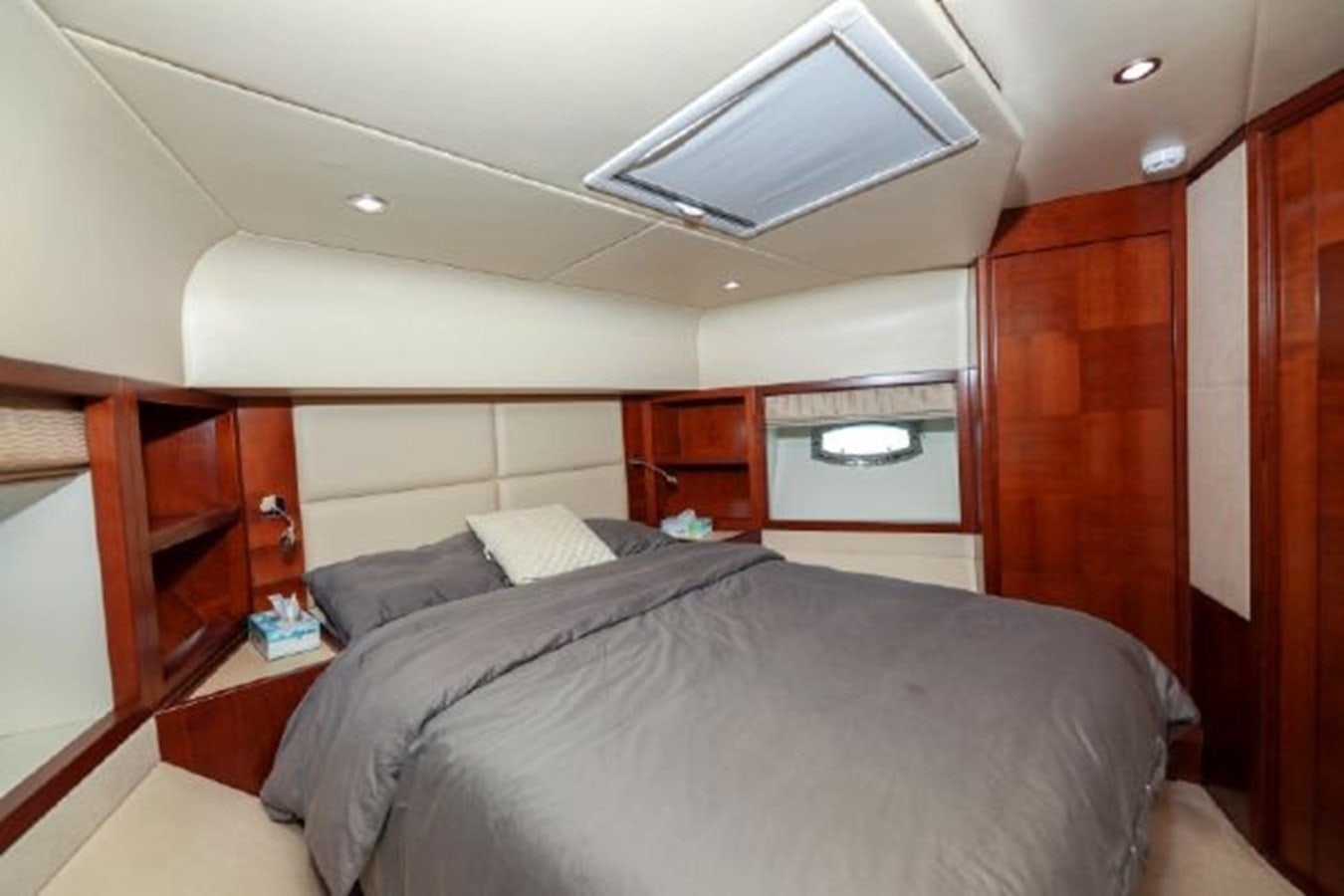 a room with a bed and a ceiling fan aboard MAJESTY 70 Yacht for Sale