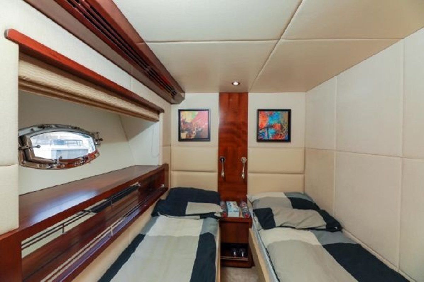 a room with two beds aboard MAJESTY 70 Yacht for Sale