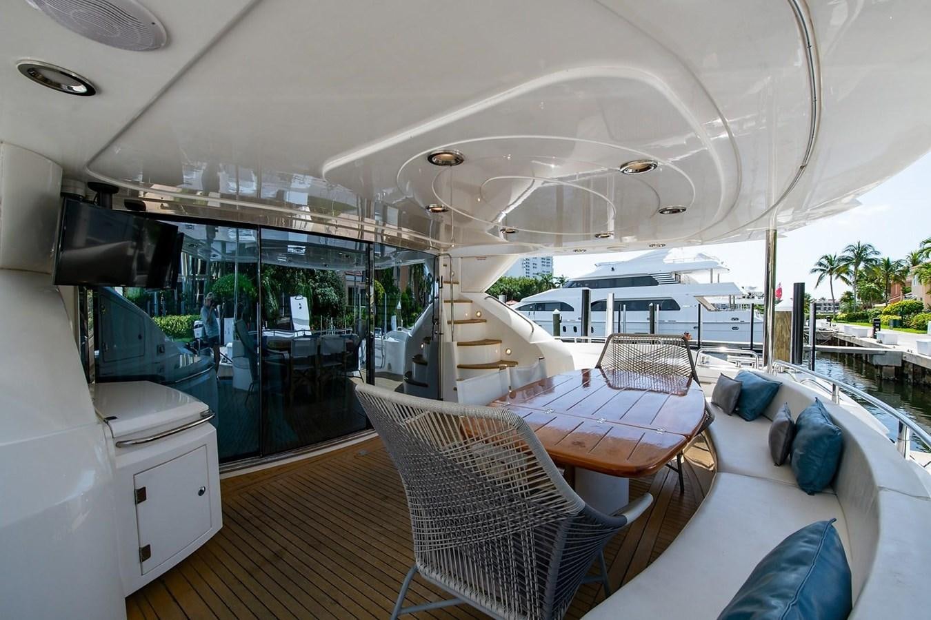 a boat with a table and chairs aboard 82 SUNSEEKER MANHATTAN  Yacht for Sale