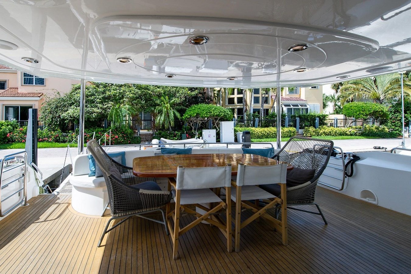 a large patio with a table and chairs aboard 82 SUNSEEKER MANHATTAN  Yacht for Sale