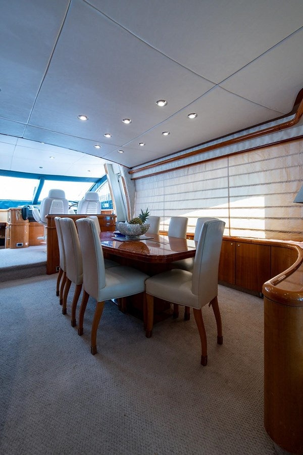 a room with a table and chairs aboard 82 SUNSEEKER MANHATTAN  Yacht for Sale