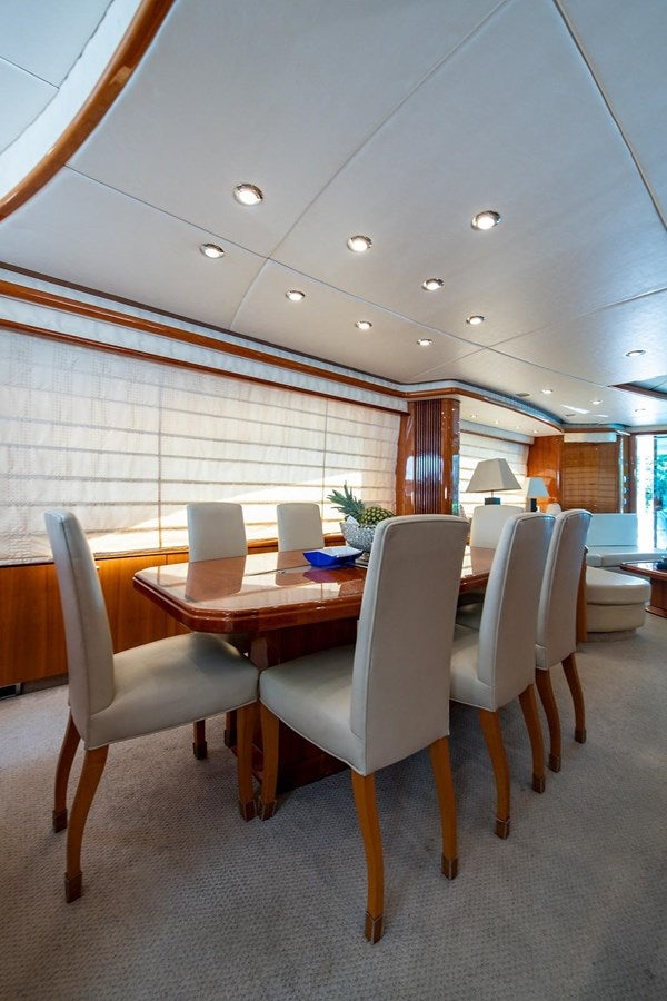 a room with tables and chairs aboard 82 SUNSEEKER MANHATTAN  Yacht for Sale