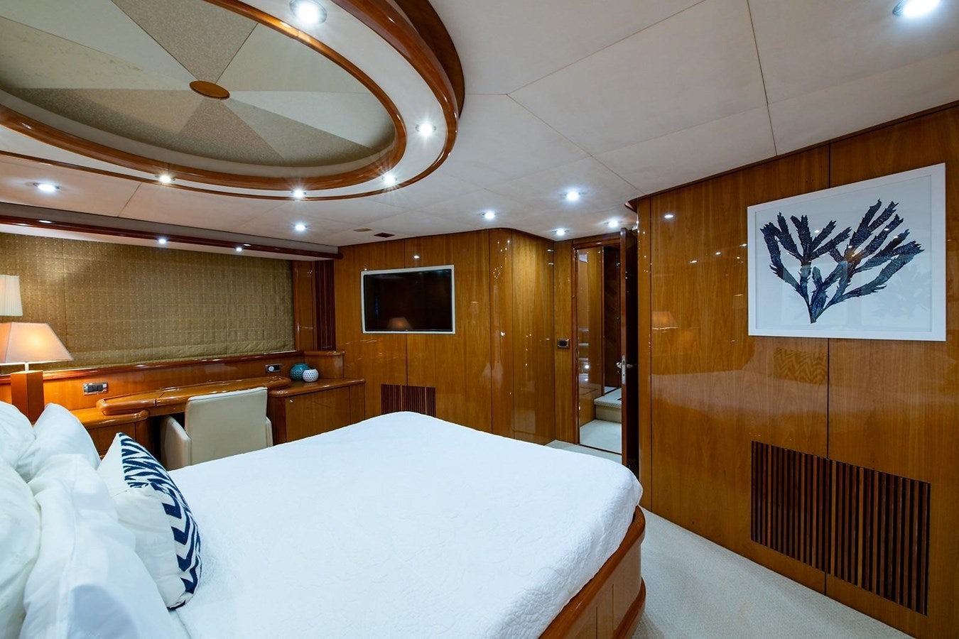 a hotel room with a bed and a television aboard 82 SUNSEEKER MANHATTAN  Yacht for Sale