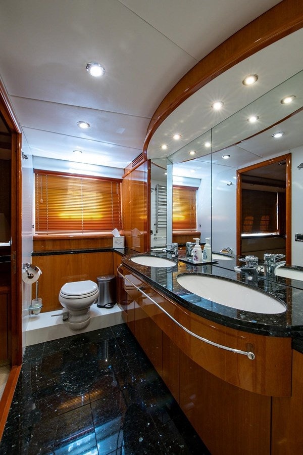 a bathroom with a large mirror aboard 82 SUNSEEKER MANHATTAN  Yacht for Sale