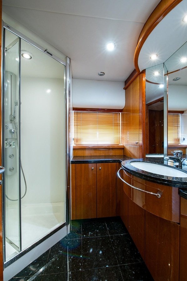 a bathroom with a shower unit and sink aboard 82 SUNSEEKER MANHATTAN  Yacht for Sale