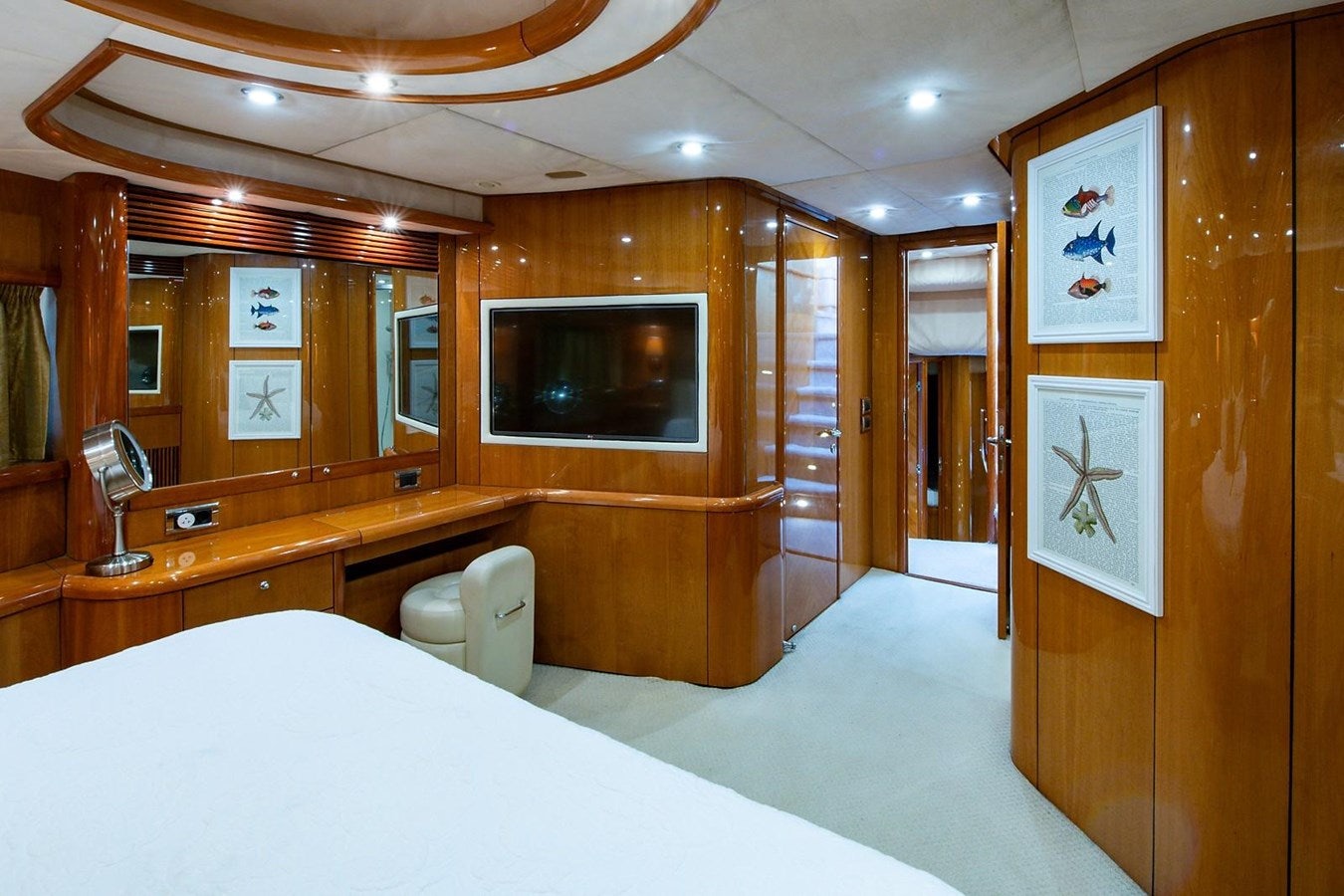 a room with a bed and a television aboard 82 SUNSEEKER MANHATTAN  Yacht for Sale