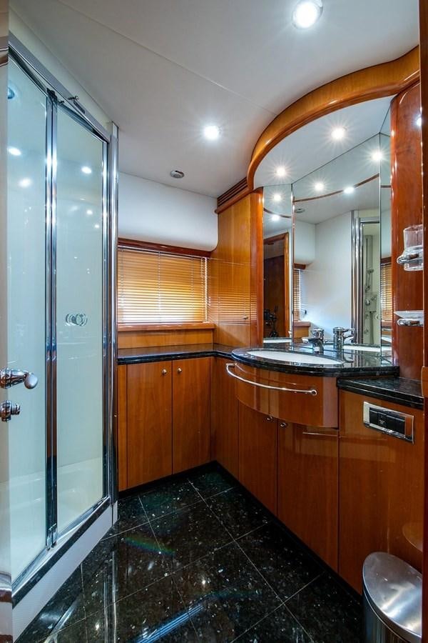 a bathroom with a glass shower aboard 82 SUNSEEKER MANHATTAN  Yacht for Sale