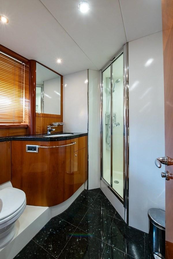 a bathroom with a glass shower aboard 82 SUNSEEKER MANHATTAN  Yacht for Sale