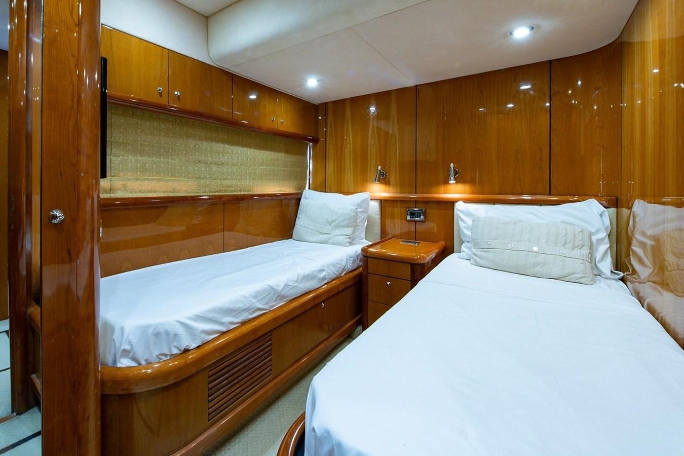 a couple of beds in a room aboard 82 SUNSEEKER MANHATTAN  Yacht for Sale